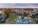 Aerial view of home with pool, patio, covered gazebo, lush lawn and built in outdoor BBQ at 7804 W Pershing Ave, Peoria, AZ 85381