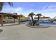 Entertaining backyard featuring a covered gazebo, pool, outdoor seating, and mature landscaping at 7804 W Pershing Ave, Peoria, AZ 85381