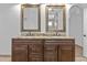 Bathroom features a double sink vanity with granite countertops and dark wood cabinets at 7804 W Pershing Ave, Peoria, AZ 85381