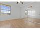 Bedroom with wood floors, large windows, and mirrored closet at 7804 W Pershing Ave, Peoria, AZ 85381