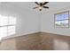 Bedroom with wood-look flooring and natural light at 7804 W Pershing Ave, Peoria, AZ 85381