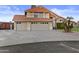 Charming two-story home featuring a three-car garage, red tile roof, and mature landscaping at 7804 W Pershing Ave, Peoria, AZ 85381