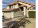 Two story home with terracotta tile roof, light stucco and walkway to the front door at 7804 W Pershing Ave, Peoria, AZ 85381