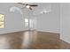 Living room featuring neutral paint, modern ceiling fan, tiled floors, and large windows at 7804 W Pershing Ave, Peoria, AZ 85381