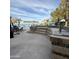 Outdoor kitchen area with tile details, a built in grill, and bar top perfect for entertaining at 7804 W Pershing Ave, Peoria, AZ 85381