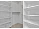 Walk-in closet with white shelving and storage space at 7804 W Pershing Ave, Peoria, AZ 85381