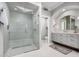 Modern bathroom featuring a large glass shower and a vanity with drawers at 7878 E Gainey Ranch Rd # 41, Scottsdale, AZ 85258