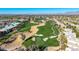 Scenic aerial view of a golf course community with meticulously manicured greens at 7878 E Gainey Ranch Rd # 41, Scottsdale, AZ 85258