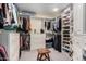 Walk-in closet featuring shelving and built-in drawers to maximize storage at 7878 E Gainey Ranch Rd # 41, Scottsdale, AZ 85258