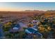 Aerial view of desert property with two houses and surrounding landscape at 831 N Arroya Rd, Apache Junction, AZ 85119