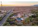 Aerial view of a property with multiple buildings, desert landscape and a road nearby at 831 N Arroya Rd, Apache Junction, AZ 85119