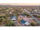 Aerial view of property with multiple buildings and a road next to desert landscape at 831 N Arroya Rd, Apache Junction, AZ 85119