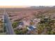 Aerial view showing a house with desert landscape and a road nearby at 831 N Arroya Rd, Apache Junction, AZ 85119