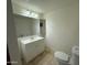 Full bathroom featuring tile flooring, modern vanity and a large mirror at 831 N Arroya Rd, Apache Junction, AZ 85119