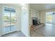 Bright entryway with built-in shelving and brick fireplace at 831 N Arroya Rd, Apache Junction, AZ 85119