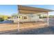 House exterior with carport and desert landscaping at 831 N Arroya Rd, Apache Junction, AZ 85119