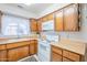 Clean kitchen with white appliances and wood cabinets at 831 N Arroya Rd, Apache Junction, AZ 85119