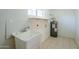 Small laundry room with sink and water heater at 831 N Arroya Rd, Apache Junction, AZ 85119