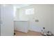 Laundry room with built-in cabinets and tile flooring at 831 N Arroya Rd, Apache Junction, AZ 85119