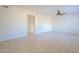 Bright living room featuring tile floors and ceiling fan at 831 N Arroya Rd, Apache Junction, AZ 85119