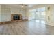 Sunken living room with fireplace, built-in shelves, and sunroom access at 831 N Arroya Rd, Apache Junction, AZ 85119