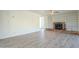 Living room with hardwood floors, fireplace, and built-in shelving at 831 N Arroya Rd, Apache Junction, AZ 85119