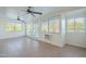 Sunroom with tile floors, multiple windows, and ceiling fans at 831 N Arroya Rd, Apache Junction, AZ 85119