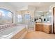 Elegant bathroom with a soaking tub, walk-in shower, and / sinks at 8375 E Via Dona Rd, Scottsdale, AZ 85266