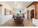 Formal dining room features a large table, stone floor, and scenic views at 8375 E Via Dona Rd, Scottsdale, AZ 85266