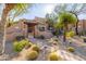 Spanish-style home with landscaped desert yard and walkway at 8375 E Via Dona Rd, Scottsdale, AZ 85266