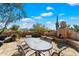 Outdoor patio with seating and a fireplace at 8375 E Via Dona Rd, Scottsdale, AZ 85266