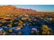 Aerial view of a home with mountain backdrop, showcasing surrounding desert landscape at 843 N Arroya Rd, Apache Junction, AZ 85119