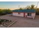 Pink house with carport and landscaping at 843 N Arroya Rd, Apache Junction, AZ 85119