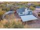 Aerial view of a charming single story home with carport and large backyard at 843 N Arroya Rd, Apache Junction, AZ 85119