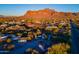 Aerial view of property showcasing desert landscape, mountain views, and house location at 843 N Arroya Rd, Apache Junction, AZ 85119