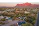 Aerial view showing a house with mountain backdrop and surrounding desert landscape at 843 N Arroya Rd, Apache Junction, AZ 85119