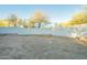 Large backyard with gravel and a high white wall at 843 N Arroya Rd, Apache Junction, AZ 85119