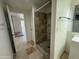 Neutral tiled bathroom features a shower and vanity sink at 843 N Arroya Rd, Apache Junction, AZ 85119