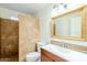 Clean bathroom with shower stall, toilet and vanity with large mirror at 843 N Arroya Rd, Apache Junction, AZ 85119