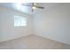 Bright bedroom with tiled floor and window coverings at 843 N Arroya Rd, Apache Junction, AZ 85119