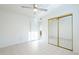 Well lit bedroom with mirrored closet and ceiling fan at 843 N Arroya Rd, Apache Junction, AZ 85119