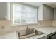 Modern kitchen sink with gray cabinets and marble countertop at 843 N Arroya Rd, Apache Junction, AZ 85119