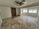 A large living room space with travertine floors and a brick fireplace at 843 N Arroya Rd, Apache Junction, AZ 85119