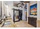 Spa-like bathroom with double sinks, a barn door, and a large mirror at 844 W Wagner Dr, Gilbert, AZ 85233