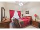 Cozy bedroom with dark wood furniture and red accents at 844 W Wagner Dr, Gilbert, AZ 85233