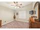 Bright bedroom with carpeted floor, window blinds, and ceiling fan at 844 W Wagner Dr, Gilbert, AZ 85233