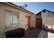 Charming backyard with orange door and patio furniture at 8520 W Palm Ln # 1049, Phoenix, AZ 85037