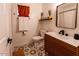 Stylish bathroom with patterned floor and modern vanity at 8520 W Palm Ln # 1049, Phoenix, AZ 85037