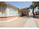 Brick home with landscaped walkway and front porch at 8520 W Palm Ln # 1049, Phoenix, AZ 85037