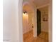 Light and bright hallway with arched doorways and wood floors at 8520 W Palm Ln # 1049, Phoenix, AZ 85037